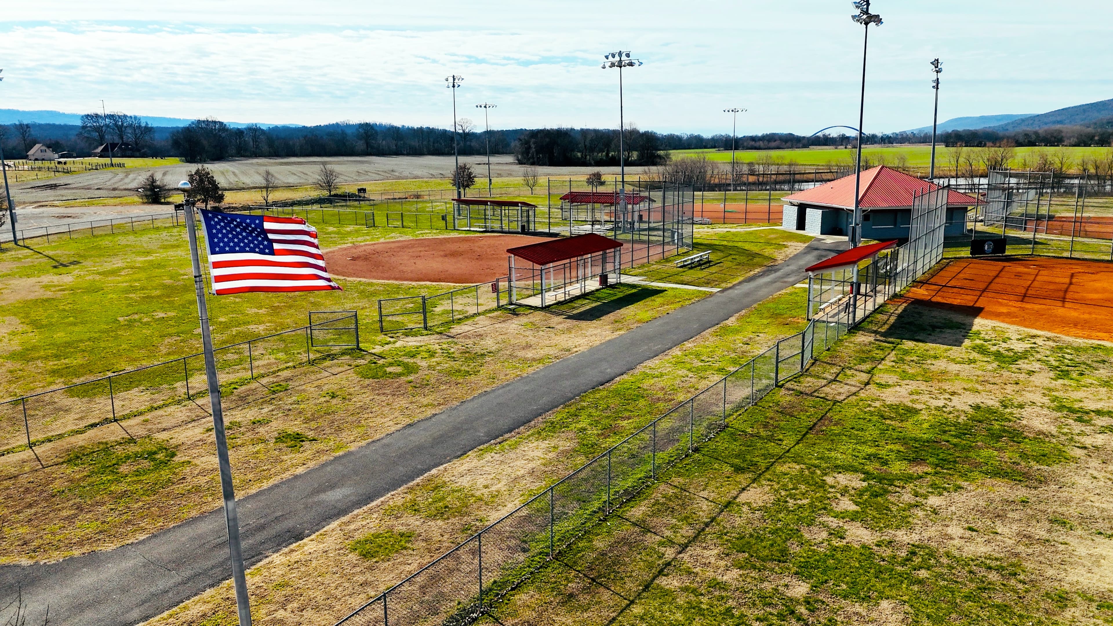Aerial drone photograph of the Kimball, Tennessee baseball complex taken by Alynto, with the park flag and field layout visible from altitude, produced as community and facility marketing imagery for a Marion County client.